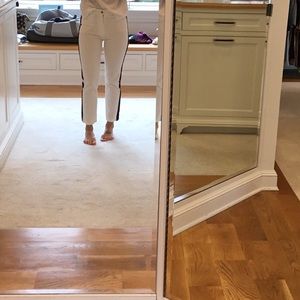 White stretch jean red and blue stripe on side.